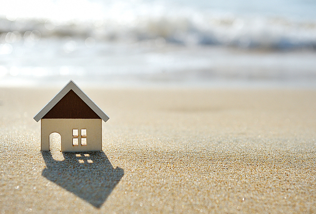 little house on the sand beach near sea